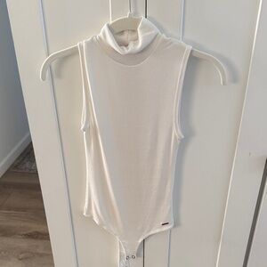 White Sleeveless Turtleneck Ribbed Bodysuit